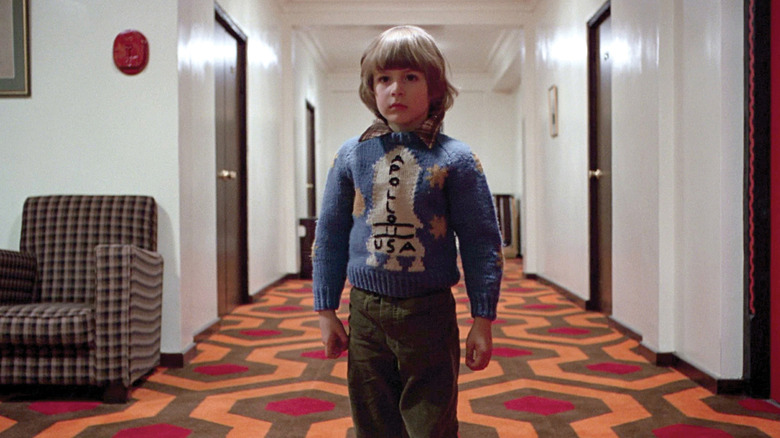 Danny Torrance standing in the hallway