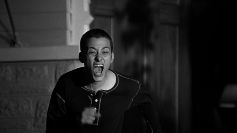Danny running and screaming outside of his house