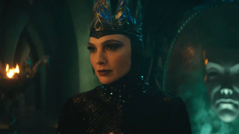 Evil Queen looking mad in front of magic mirror in Snow White (2025)
