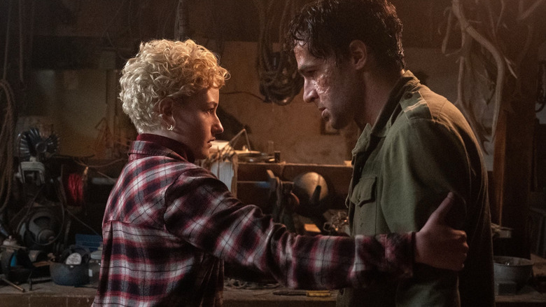 Blake Lovelly getting tended to by his wife in Wolf Man (2025)
