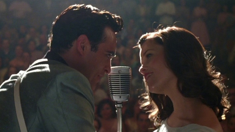 Johnny Cash singing onstage with June Carter