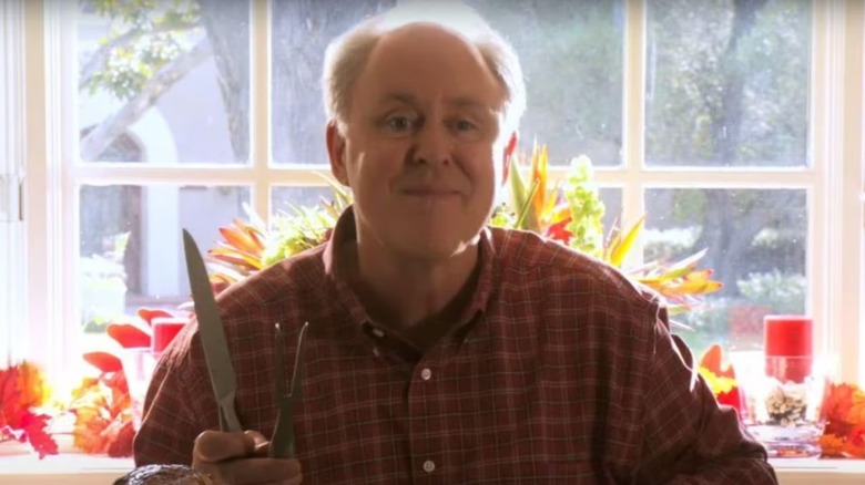Arthur holding a carving knife in "Dexter."