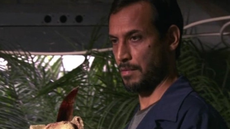 George cleaning a knife in Dexter.