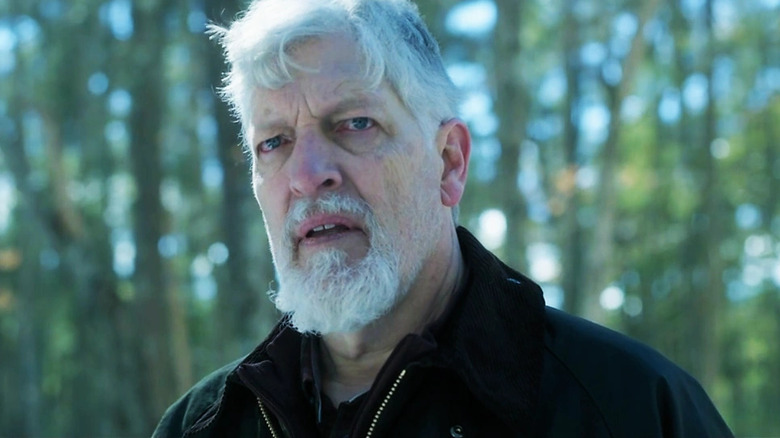 Kurt frowning in the woods in "Dexter: New Blood."