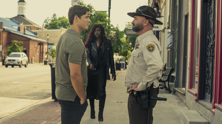 Dick Grayson stands off cop