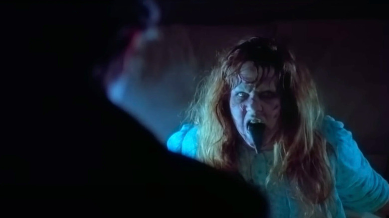 Regan in her possessed form causing chaos in The Exorcist (1973)