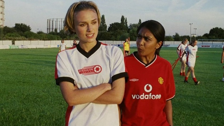 Jules and Jess standing on the soccer pitch in Bend It Like Beckham (2002)