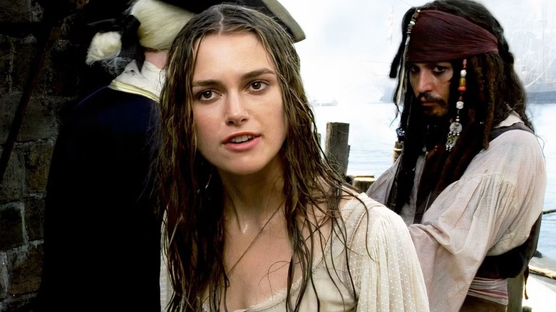 Elizabeth protests as Jack looks on in Pirates of the Caribbean: Curse of the Black Pearl (2003)