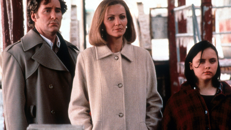 Ben, Elena, and Wendy Hood stand on a train platform in 'The Ice Storm' (1997)