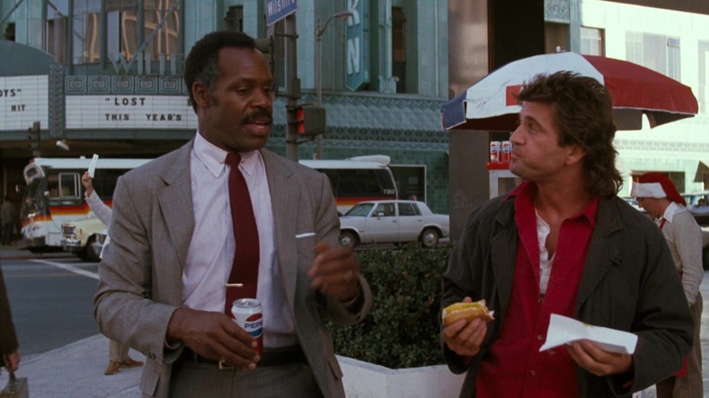Mel Gibson and Danny Glover talking