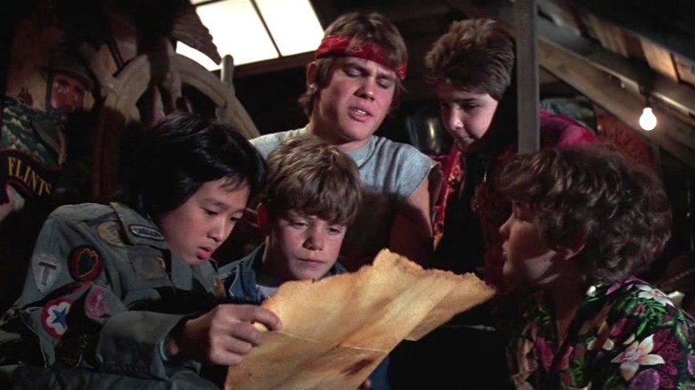 The Goonies look at treasure map