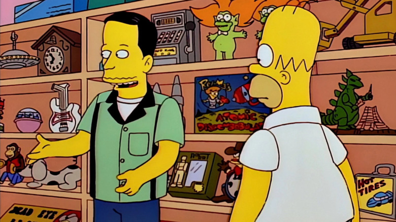 John showing Homer his store in "Homer's Phobia" (1997)