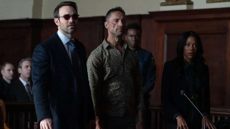 Matt (Charlie Cox), Hector (Kamar de los Reyes), and Kiersten (Nikki M. James) awaiting a judge's verdict