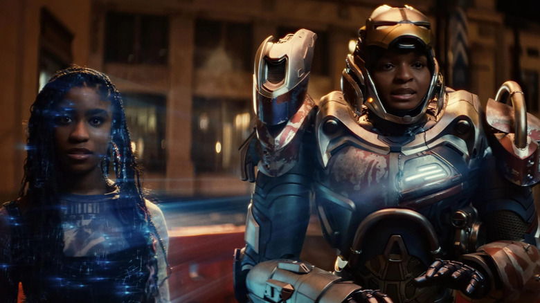 A.I. Natalie (Lyric Ross) and Riri (Dominique Thorne) in her armor, attempting to de-escalate a situation