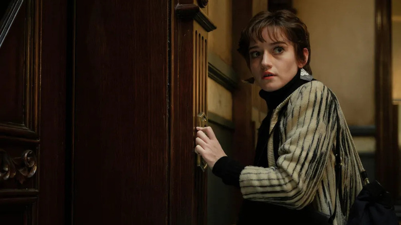 Terry calls for an elevator in "Apartment 7A" (2024)