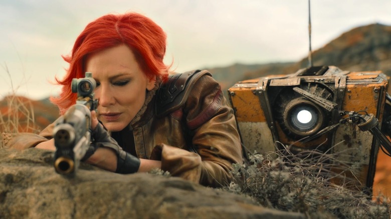 Lilith aims a rifle as ClapTrap watches in "Borderlands" (2024)