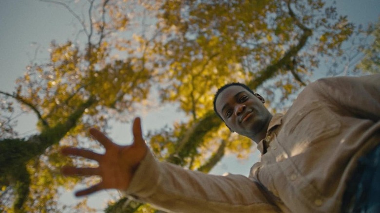 View from below as Elwood reaches out his hand in "Nickel Boys" (2024)