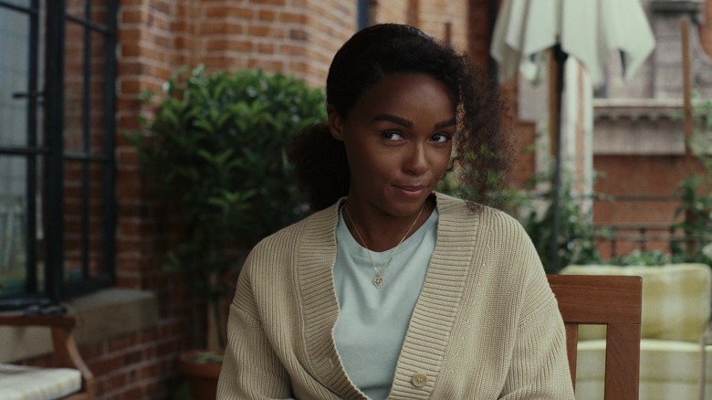 Helen smiles on a porch in "Glass Onion: A Knives Out Mystery" (2022)