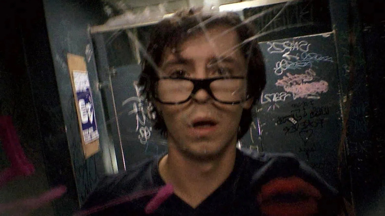 Drunk guy looks in the mirror