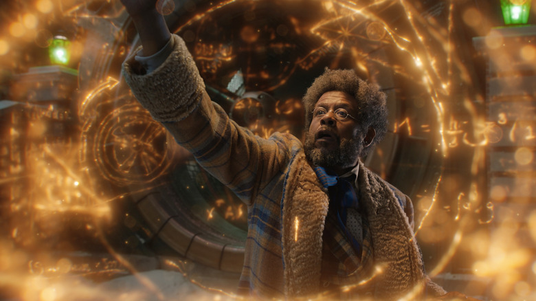 Jeronicus surrounded by light holograms in his workshop