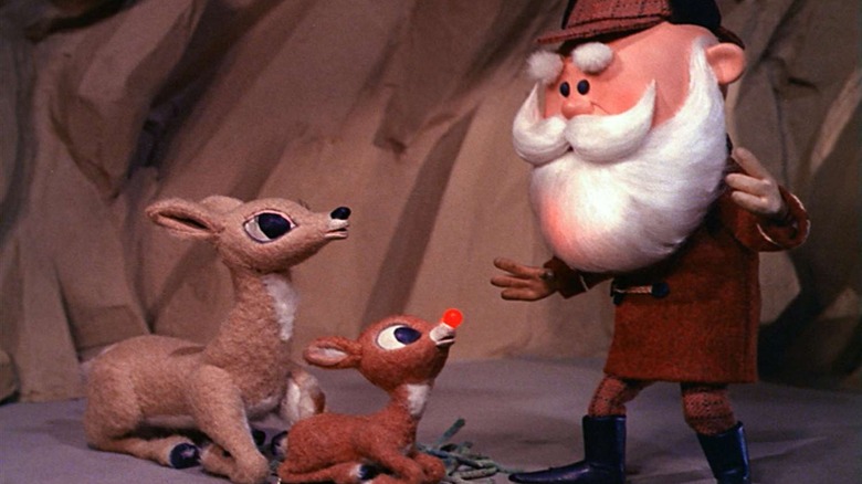 Rudolph and his mother talk to Santa Clause in a cave