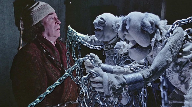 Scrooge faces the Marley brothers in his house
