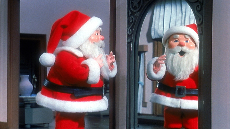 Santa Claus looks in the mirror