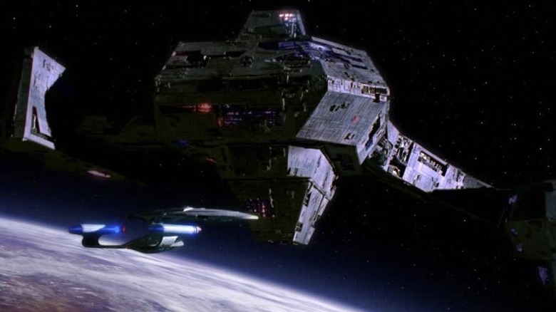 A giant borg ship dwarfs the Enterprise in Star Trek: The Next Generation