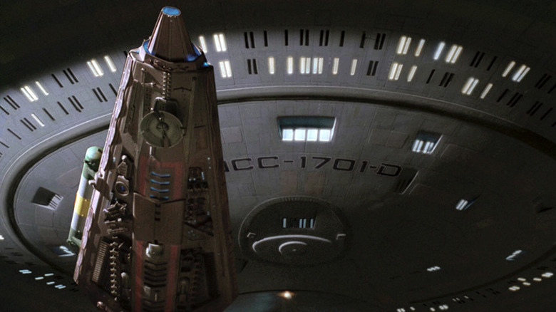 The Mondor flies in front of the Enterprise in Star Trek: The Next Generation