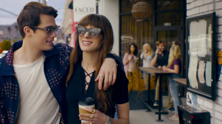 Hayes and Soléne walking down the street in sunglasses in The Idea of You