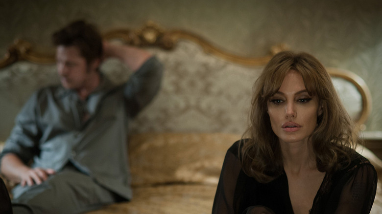 Brad Pitt Angelina Jolie sit on bed By the Sea