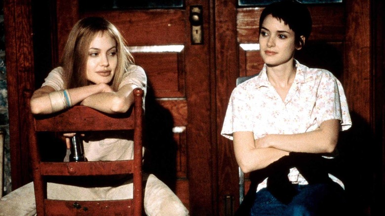 Angelina Jolie sits backwards in chair in Girl, Interrupted