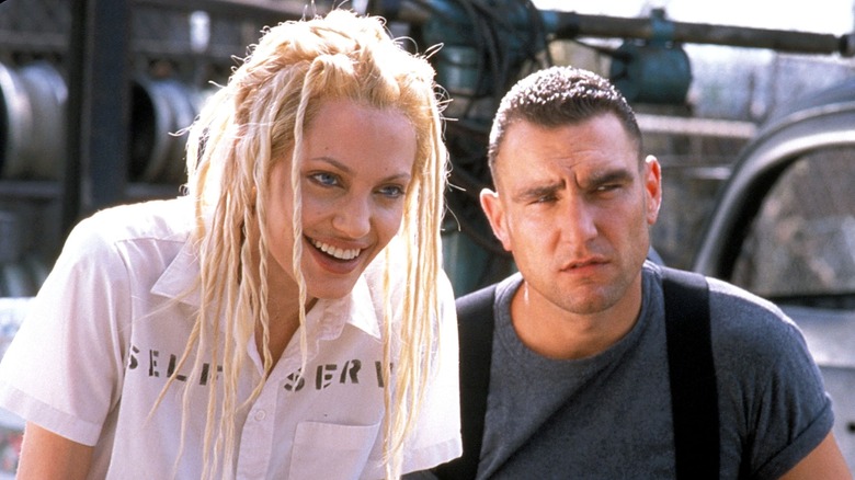 Angelina Jolie, Vinnie Jones at junkyard in Gone in 60 Seconds