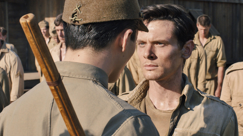 Jack O'Connell in Unbroken stands up against officer