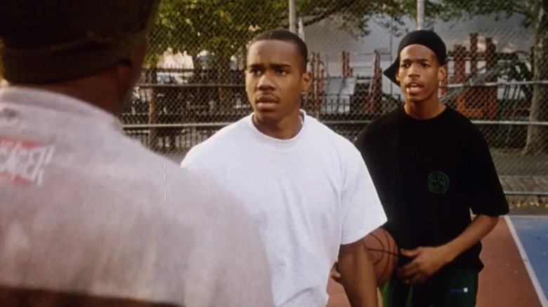 Kyle (Duane Martin) and Bugaloo (Marlon Wayans) are confronted by Birdie (Tupac Shakur) on the court in Above the Rim