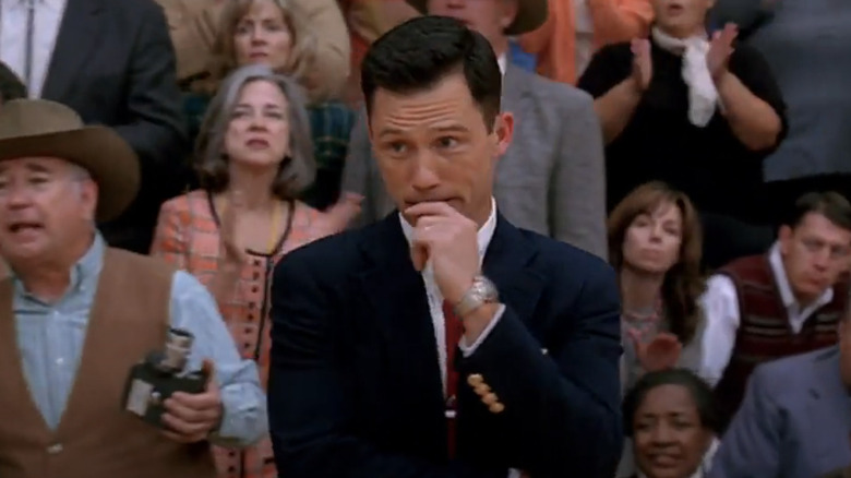 Coach Driscoll (Jeffrey Donovan) stands on the sideline worried in Believe in Me
