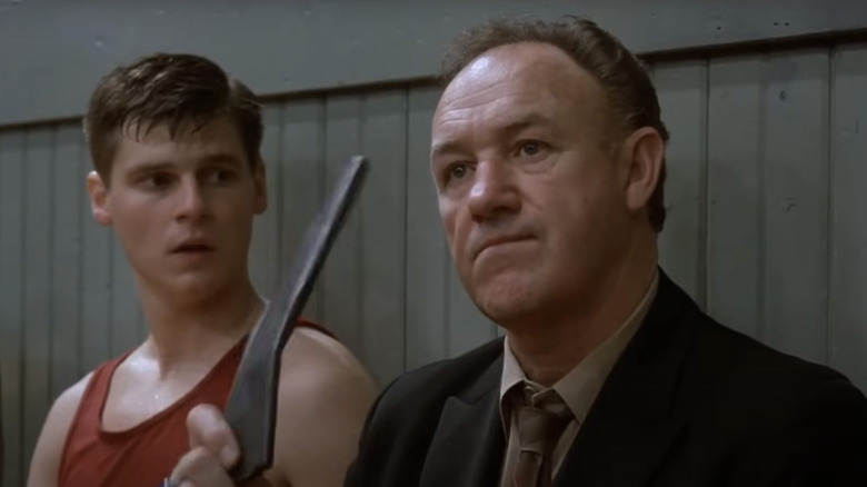 Norman Dale (Gene Hackman) sits on the bench, frustrated in Hoosiers
