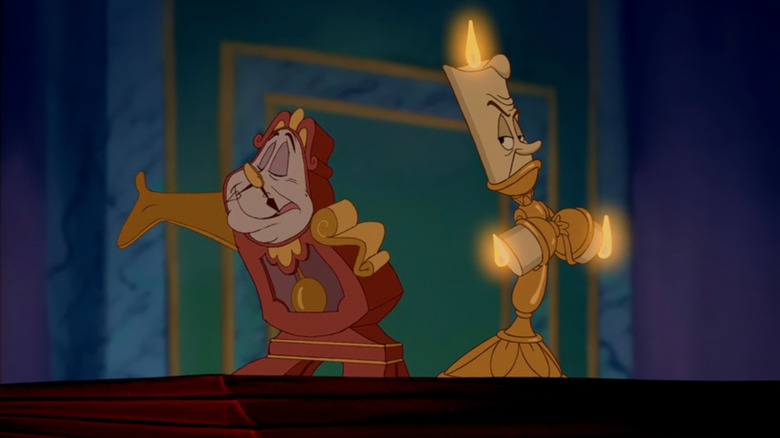 Cogsworth smiling and stretching out arm as Lumiere turns and crosses arms in "Beauty and the Beast"