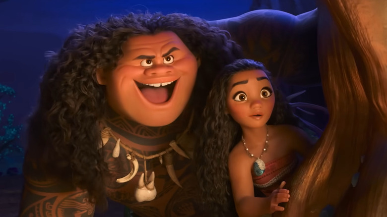Moana and Maui looking from behind corner in "Moana"