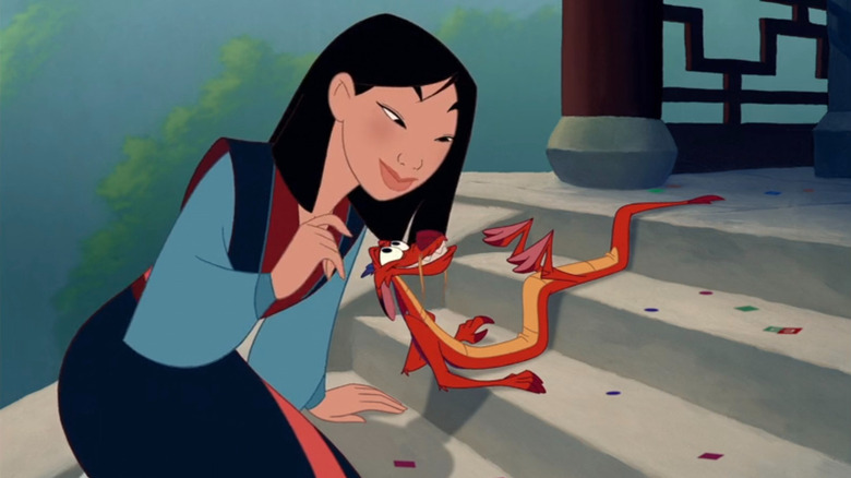 Mulan and Mushu smiling at each other on stairs in "Mulan"