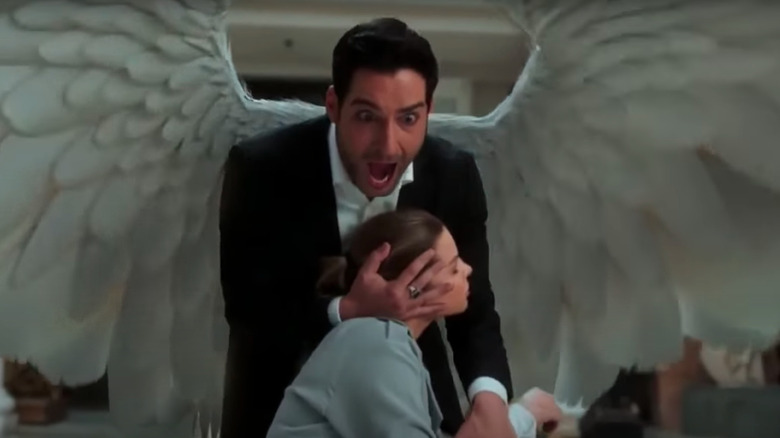 Lucifer uses his wings to shield Chloe