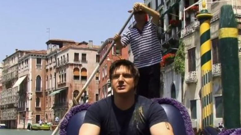 Zak taking a ride in a gondola in "Ghost Adventures"