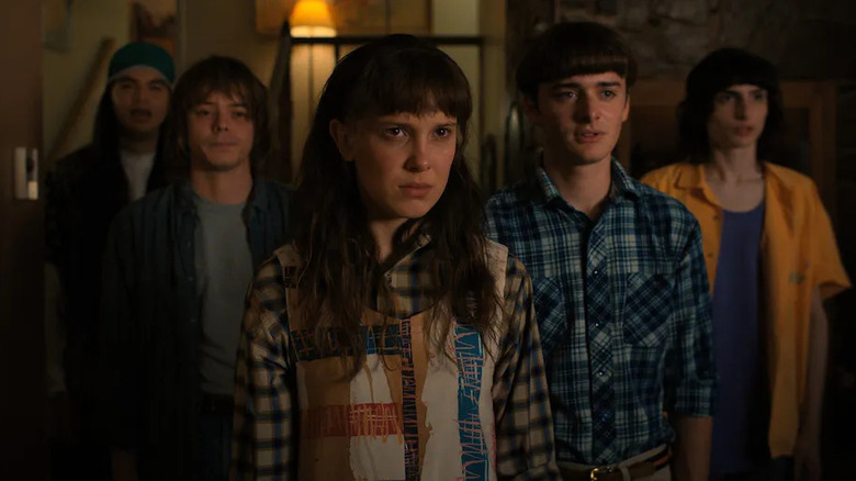Eleven stands in front of her friends in "Stranger Things" (2016-2025)