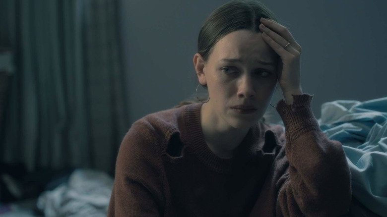 Nell weeps, holding her head in "The Haunting of Hill House" (2018)