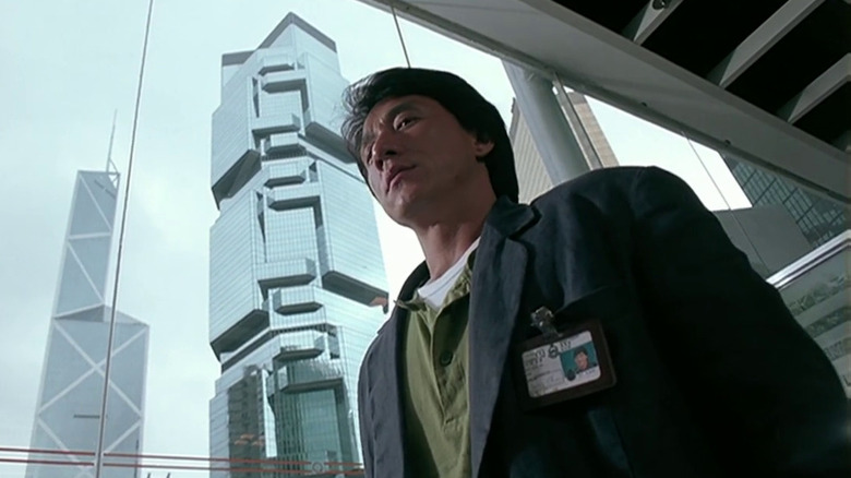 Inspector Chan from below as he walks through a downtown area in Crime Story