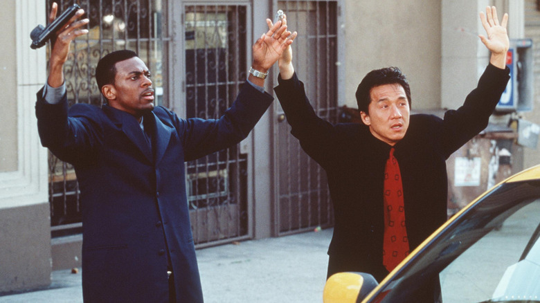 Carter and Lee holding up their hands in Rush Hour