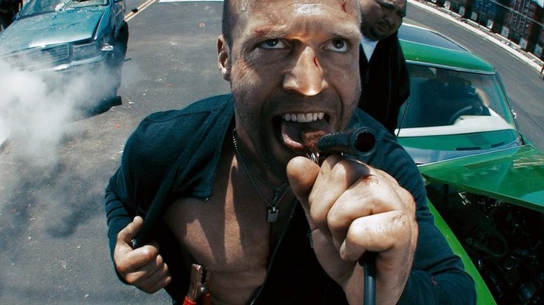 Chelios puts a jumper cable into his mouth in "Crank: High Voltage" (2009)
