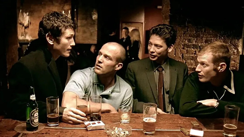 Eddie, Soap, Tom, and Bacon sit at a bar drinking in "Lock, Stock, and Two Smoking Barrels" (1998)