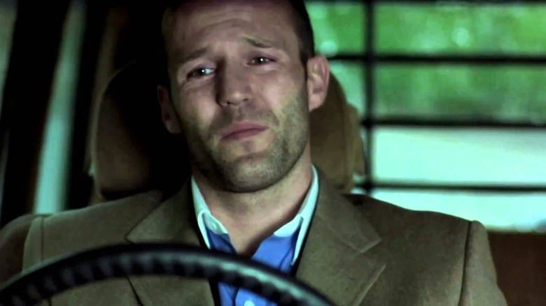Turkish sits behind the wheel of a truck in "Snatch" (2000)