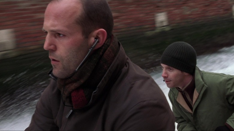Rob pilots a speed boat through a channel in "The Italian Job" (2003)